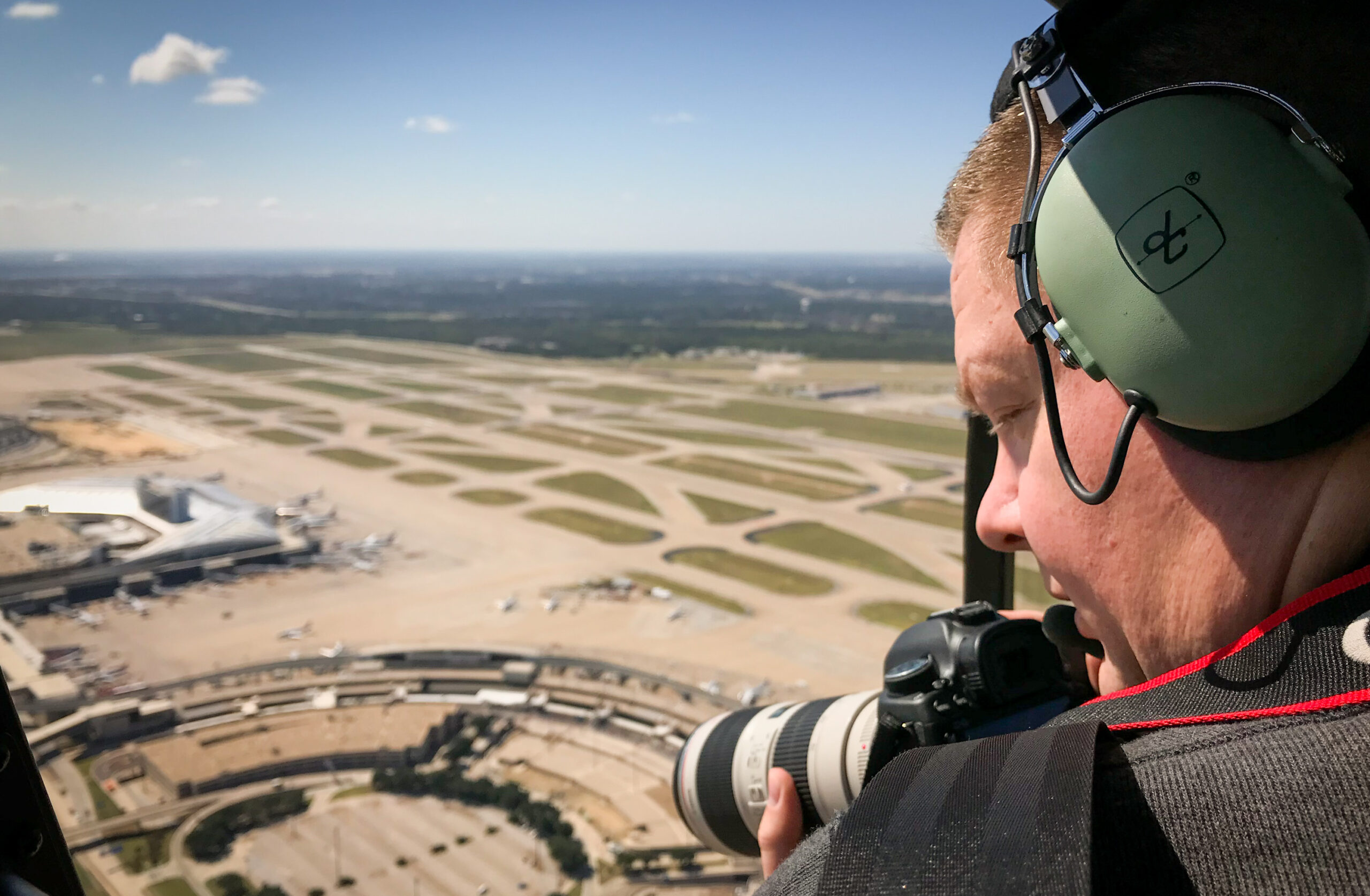 Aviation Photographer Mark Alberts photographing DFW International Airport from a helicopter